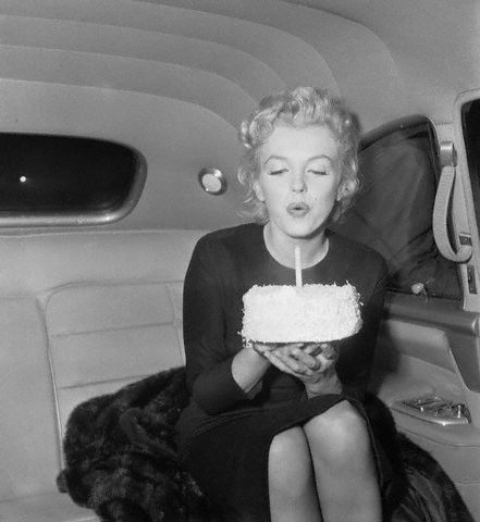 Marilyn Monroe Blowing Out Candle On 30th Birthday Cake